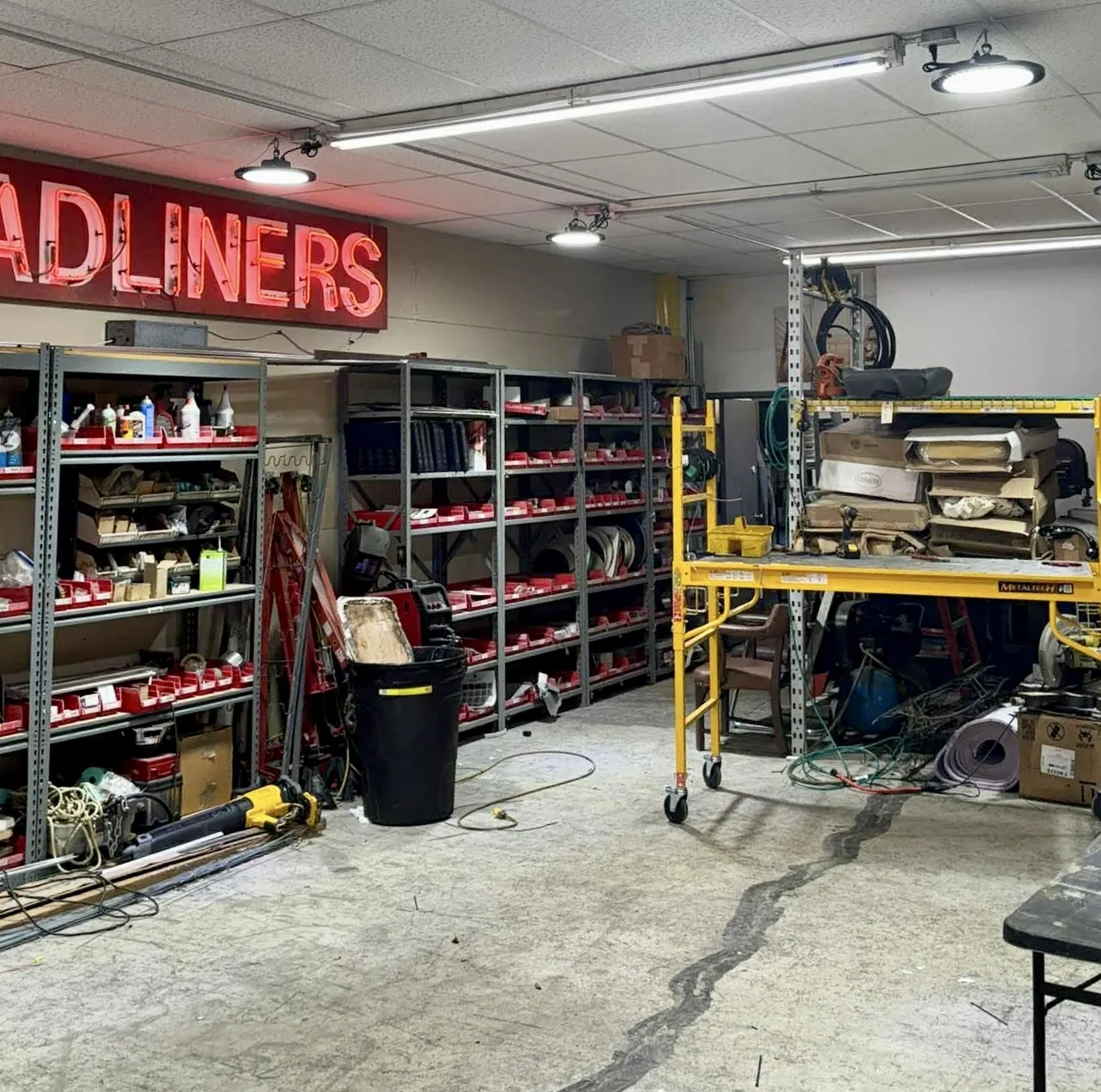 Working interior of Roger's Lone Star Trim shop on Regal Row — tools, materials, and trim work in progress