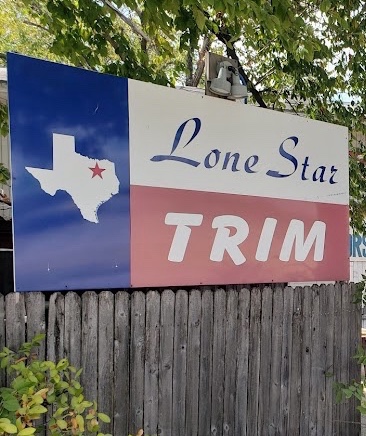 Hand-painted Lone Star Trim sign at the Dallas shop